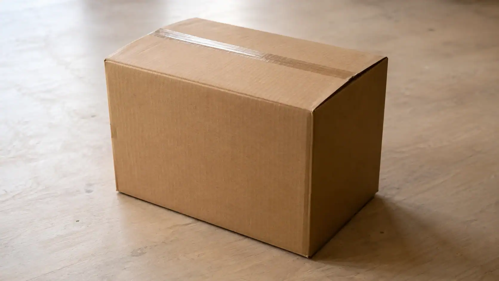 A standard large international removal box (65×45×45cm) — one CBM holds 7 to 8 boxes like this