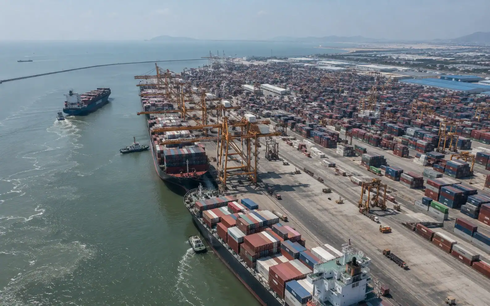 Aerial view of Laem Chabang container terminal with multiple vessels berthed, or a close-up of shipping containers stacked at port with a cost breakdown or freight invoice document overlaid
